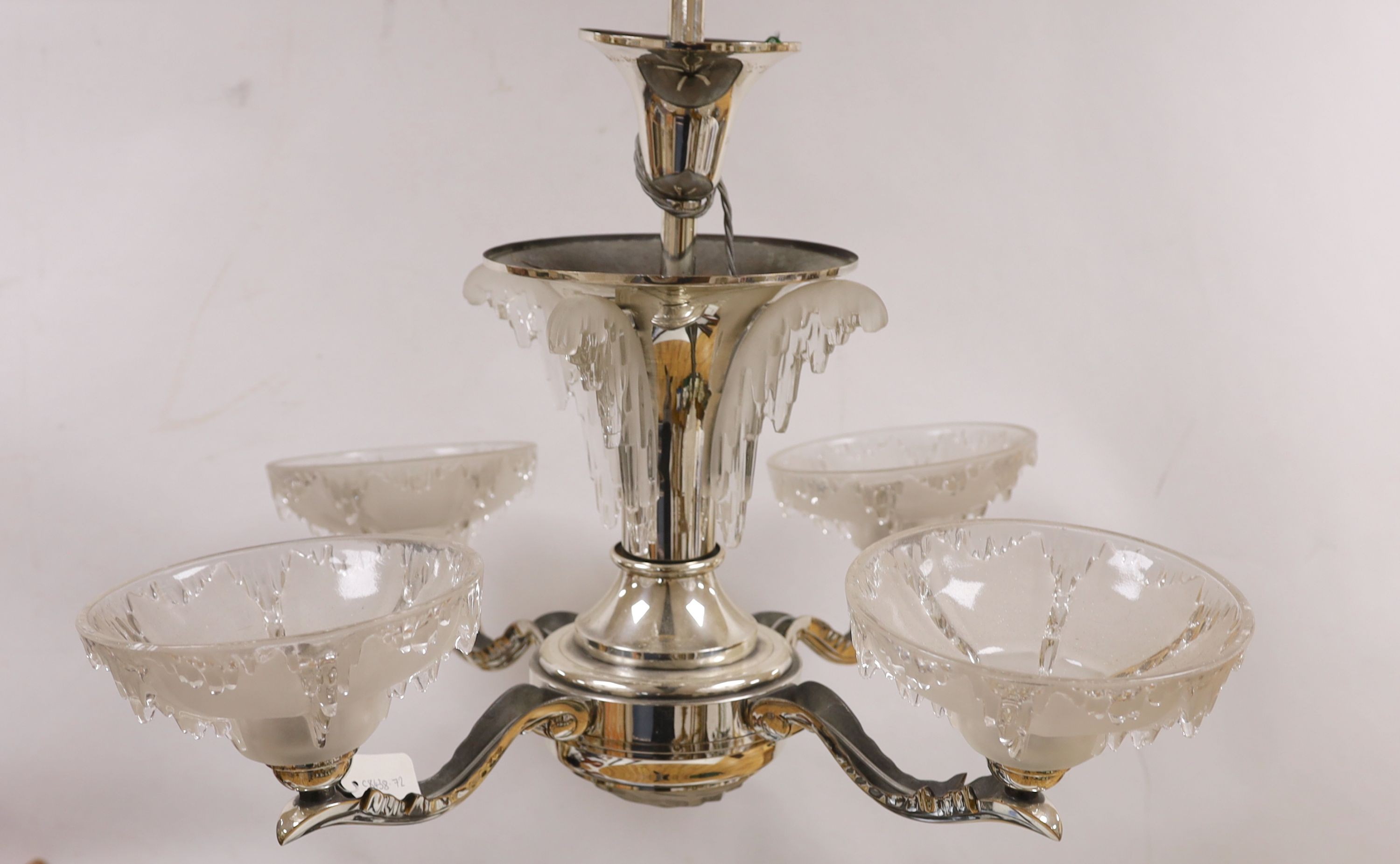 A chrome Art Deco 4 branch electrolier, with frosted glass shades, 77 cms high.